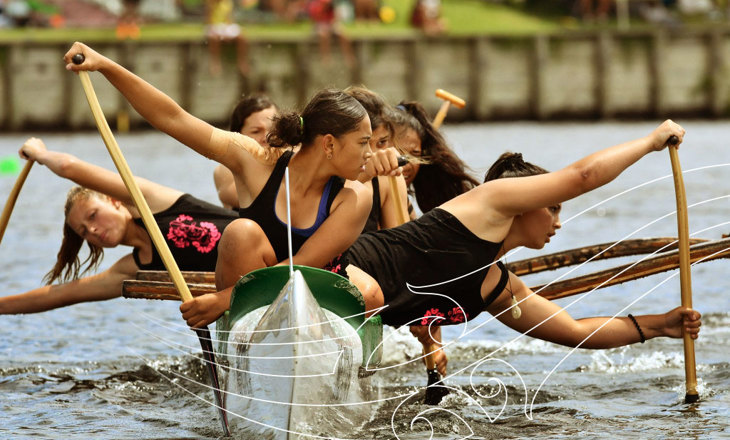 Wahine rowing a waka