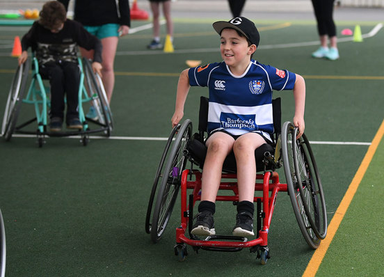 Boy in wheelchair on a court