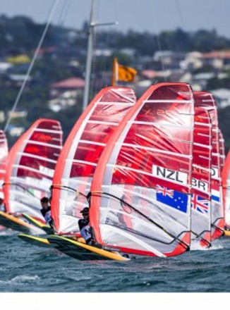 Yachts on a body of water at the Youth Sailing World Champs