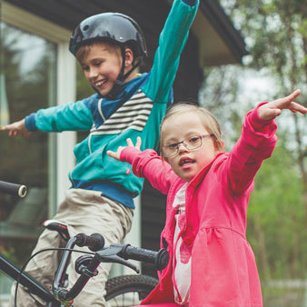 Tamariki balancing on their bikes