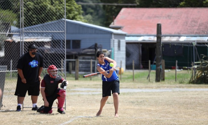 Group of rangatahi playing softball