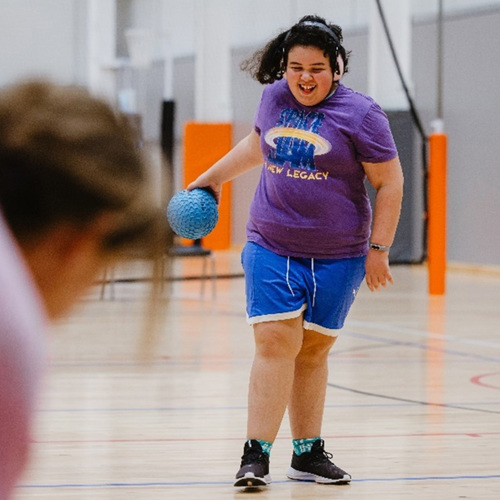 Tamariki playing basketball