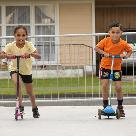Kids riding on scooters image